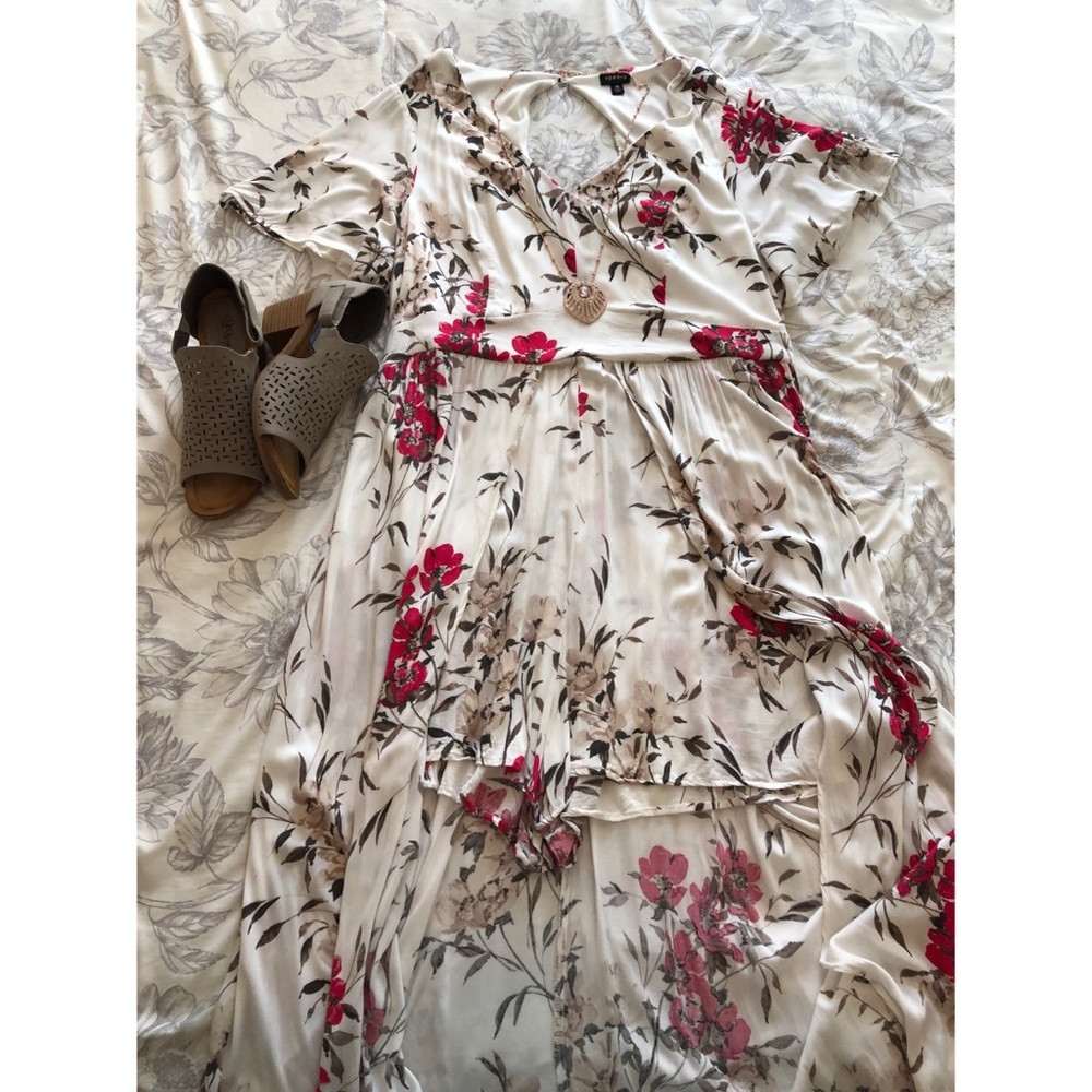 Cream romper with Skirt overlay.